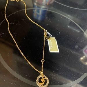 Mk gold plated necklace 16 inches with clear stones on the MK